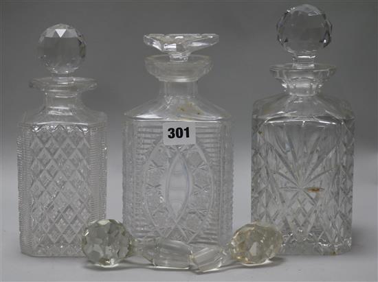 Three cut glass decanters